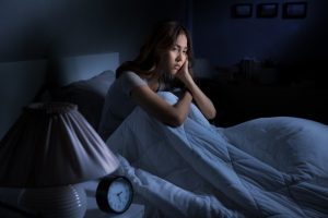 depressed-young-asian-woman-sitting-bed-cannot-sleep-from-insomnia